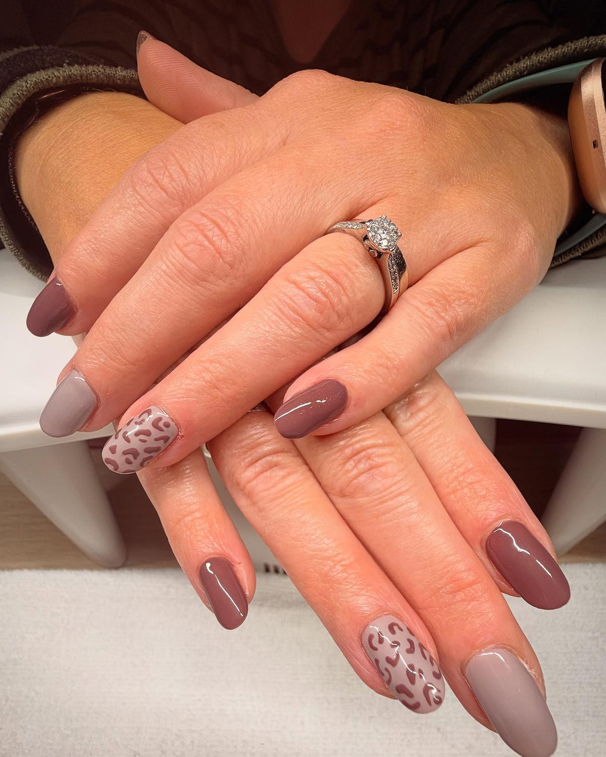 Mauve and grey almond nails with tonal leopard-print accent nails
